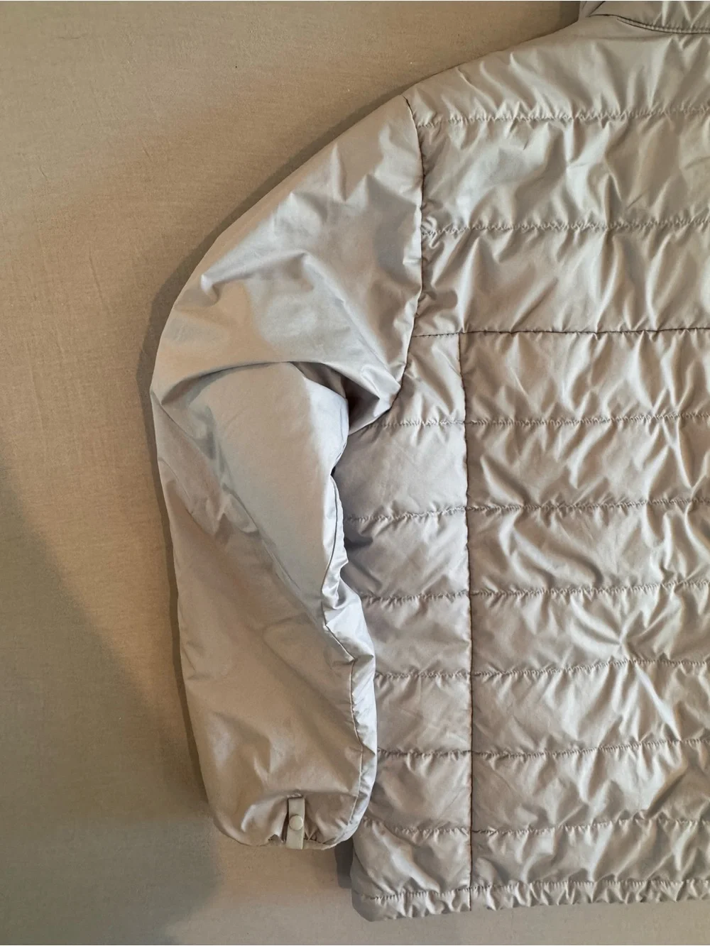 The North Face Light Gray Men's Puffer Jacket with Blue Accents